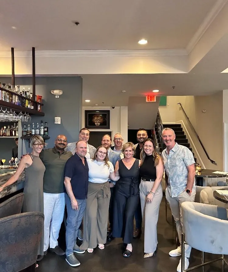 MyKohi team and guests posing for a group photo in a restaurant